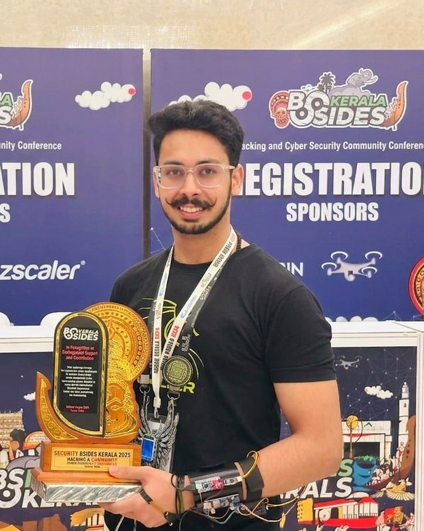 Rahul Thareja, founder of CipherBionics, with his BSides Kerala 2025 award and EMG armband